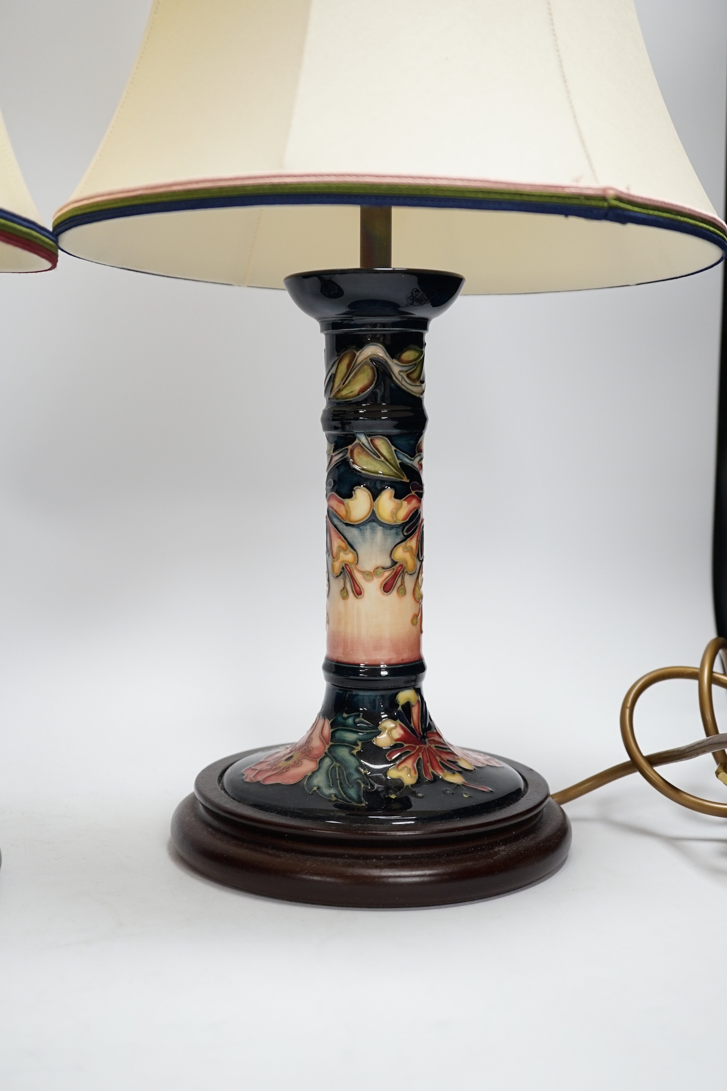 Two Moorcroft lamp bases, in Oberon and Violet patterns, 47cm high